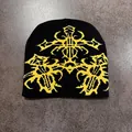 Detailed knit texture of black beanie with yellow gothic totem pattern design - Black and Yellow