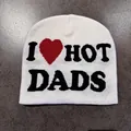 Close-up of white knitted beanie with black I Heart Dads text on grey background - I ❤️ HOT DADS Style / White
