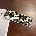 Close-up of a cow pattern knitted sports headband with high-elasticity fabric texture - Leopard Print
