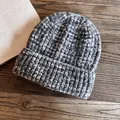 Close-up of grey and white knit beanie with ribbed texture on rustic wooden background - M(55-59cm) / Black and Gray
