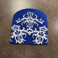 Detailed close-up of blue knit beanie with white ethnic jacquard patterns - M (54-59cm) / Sapphire Blue
