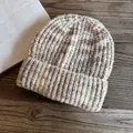Detailed close-up of thick ribbed knit texture on a brown and beige marbled beanie - M(55-59cm) / Khaki