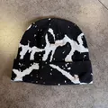 Detail view of the black and white abstract graffiti jacquard pattern on a knit beanie - M (55-59cm) / Black and Gray