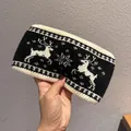 Detail of deer and snowflake jacquard knit pattern on the warm winter wide headband - Black