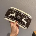 Close-up of winter knit headband featuring reindeer and snowflake jacquard texture - Coffee