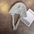 Detail of light gray knit balaclava hat with thick wool texture and warm earflaps - M (55-59cm) / Light Gray