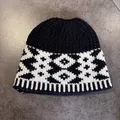 Detail of vintage knitted fisherman hat with black and white Nordic geometric patterns - Black