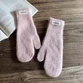 Detailed close-up of pink knit mittens with rib texture and FASHION patch detail - One Size / Pink