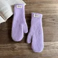 Detailed macro view of lavender faux fur mittens with a stylish white fashion label - One Size / Purple