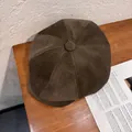 Detailed top view of dark brown corduroy newsboy cap showing stitched panels and top button - M (55-58cm) / Chestnut