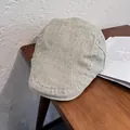 Dettaglio del cappello piatto kaki chiaro che mostra la trama del tessuto twill - M (55-59cm) / Verde Grigastro