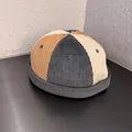 Detailed view of color-block corduroy docker hat with stitch texture and brim detail - Brimless Docker Cap / Grey Rice Yellow Patchwork
