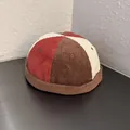 Detail of multi-color corduroy miki hat with retro patchwork and ventilation eyelets - Brimless Docker Cap / Brown Rice Red Patchwork