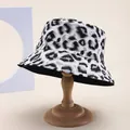 Detailed view of leopard print bucket hat with textured fabric on a wooden stand - M (55-58cm) / Grayish White