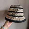Close-up of tricolor striped crochet bucket hat with hollow woven texture and soft handfeel - Black/Rice/Khaki