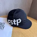 Close-up of black five-panel quick-dry cap with white Estp print on wooden surface - Adjustable / Black