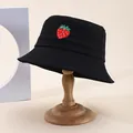 Close-up of delicate red strawberry embroidery on black cotton bucket hat fabric - M (55-58cm) / Black