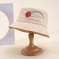 Beige cotton bucket hat with strawberry embroidery on a vintage wooden stand - M (55-58cm) / Khaki