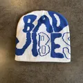 Detail view of white and blue knit beanie featuring Bad Vibes jacquard letter text - M (52-59) / White and Blue Letters