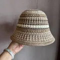 Detailed close-up of handmade crochet bucket hat featuring striped knit texture and hollow design - M / Khaki