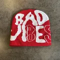 Close-up of red knit beanie showing detailed white BAD VIBES lettering texture - M (52-59) / Red and White Letters