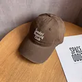 Close-up of Sunday Running Club embroidery on premium brown twill cotton baseball cap - Coffee
