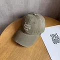 Detail of embroidered Sunday RUNNING Club logo on khaki cotton twill baseball cap - Green