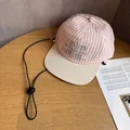 Detail of pink striped baseball cap with embroidery and adjustable windproof cord - Adult (55-60cm) / Striped Pink