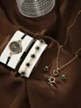 Detail view of 5-piece rose gold jewelry set with green heart gems and quartz watch - Heart Rhinestone Watch Necklace Bracelet Ring Earrings / Black