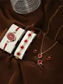 Detailed view of women's quartz watch and heart jewelry set with red gems in rose gold - Heart Rhinestone Watch Necklace Bracelet Ring Earrings / Light Gold Red