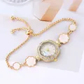 Elegant goudkleurig armbandhorloge met zonnebloem en strass-bezel met parelmoer wijzerplaat - Goud