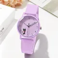 Macro view of purple quartz watch dial with cute cat pattern and silicone strap - Violet