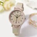 Close-up of a small dial quartz watch with cream leather strap and heart-tipped second hand - Off White
