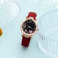 Detail of rose gold watch with star-patterned black dial and red leather strap - Red With Rose Gold Heart Bracelet