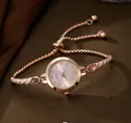 Elegant rose gold women's quartz watch with pink dial and rhinestone accents - Watch Only / Pink