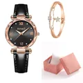 Gros plan sur une montre or rose à chiffres romains et bracelet étoile assorti dans sa boîte - Montre Bracelet Et Boîte Cadeau / Noir