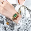 Detail of elegant gold chain watch with vintage green rectangular dial on wrist - Gold Case Green Dial