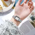 Elegant women's square silver quartz watch with stainless steel strap on a wrist - Silver White Dial