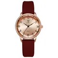 Macro detail of quartz watch with rose gold metal case and dark reddish-brown silicone strap - Brown
