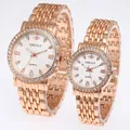 Detail of rose gold quartz couple watches with diamond bezels and Roman numerals - Men's Rose Gold White Dial