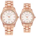 Detail of rose gold quartz watches with fluted bezel and crystal hour markers - Women's Rose Gold White Dial