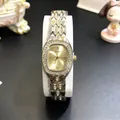 Detail view of two-tone diamond-set steel band and sunburst dial of a luxury watch - Two-tone (Gold & Silver)