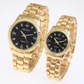 Macro view of gold quartz watches with black dial and diamond-set markers for couples - Men's Gold Case Black Dial