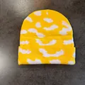 Detail of yellow knit beanie with white cloud pattern showing thick textured weave - S (52-59cm) / Yellow