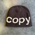 Detailed close-up of dark brown beanie featuring white jacquard copy letter knit texture - M (54-59cm) / Coffee