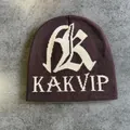 Detailed close-up of dark brown knit beanie featuring white jacquard AK lettering - M (54-59cm) / Coffee