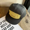 Detail of breathable mesh panels and yellow fabric on a five-panel baseball camping cap - Adjustable / Black Brim