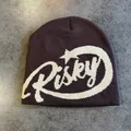 Close-up of Risky letter jacquard knit texture on dark brown warm winter beanie hat - M(54-59) / Coffee