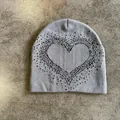 Close-up of grey knitted beanie with heart pattern showing detailed fabric texture - M (52-59) / Gray