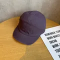 Detail shot of a purple 5-panel canvas cap showing fabric texture on a wooden table - Adjustable / Purple